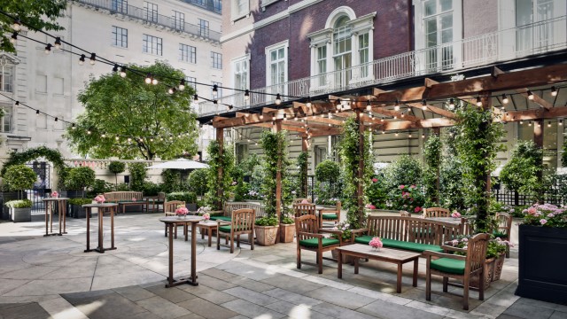 Style and heritage come together at The Langham. Credit: The Langham. Image courtesy of The Langham. The outdoor courtyard of The Langham, London filled with comfortable seating, greenery and festoon lights