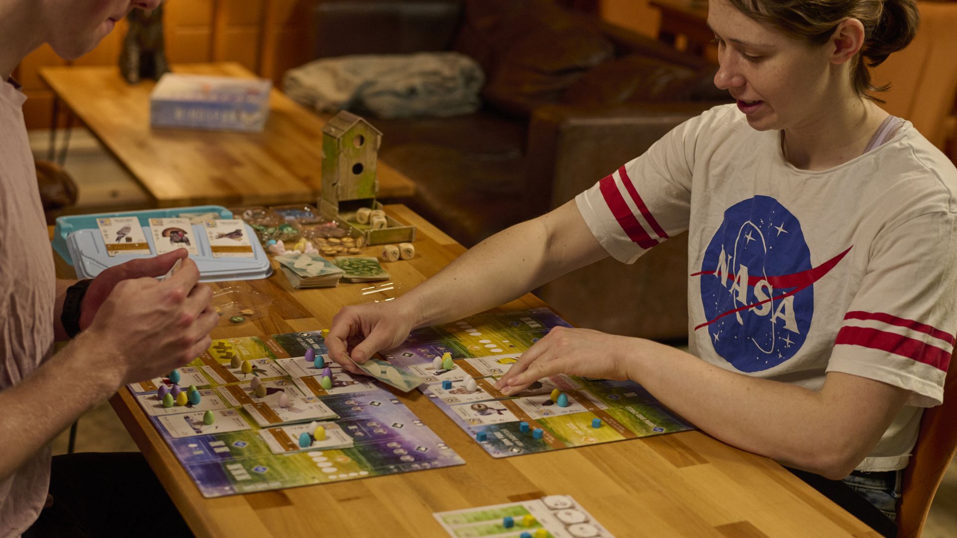 Enjoy a social mixer night or themed evening at Otter Chaos. Image courtesy of Otter Chaos. Two people playing a board game across a table at Otter Chaos.