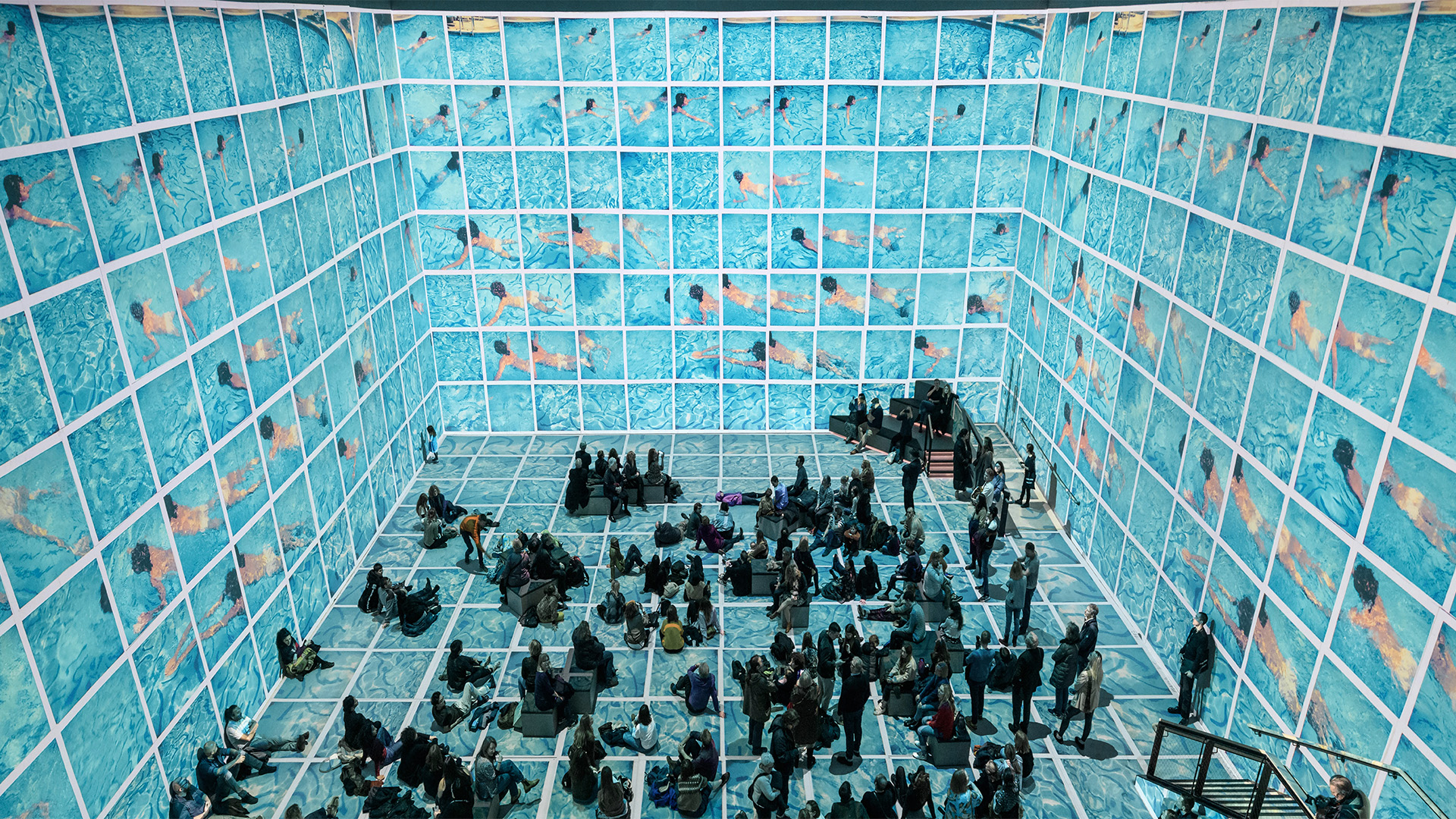 Light projections and thrilling soundscapes bring Hockney's artwork to life. Image courtesy of Lightroom. A Hockney pool painting covers the wraparound space at Lightroom.