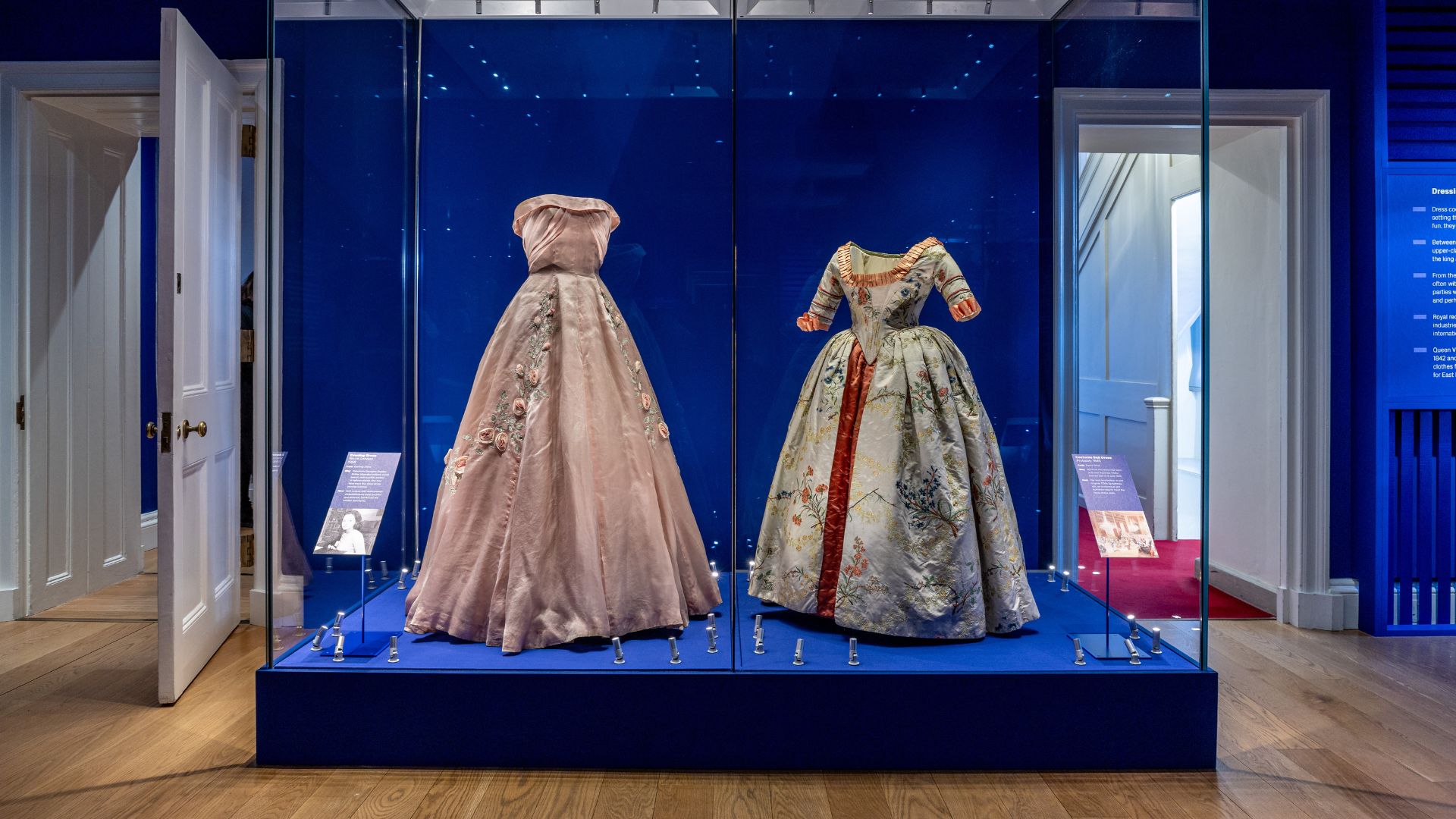 See dazzling court dresses at Kensington Palace’s Dress Codes exhibition. © Historic Royal Palaces. Two court dresses exhibited next to each other at Kensington Palace's Dress Codes exhibition.