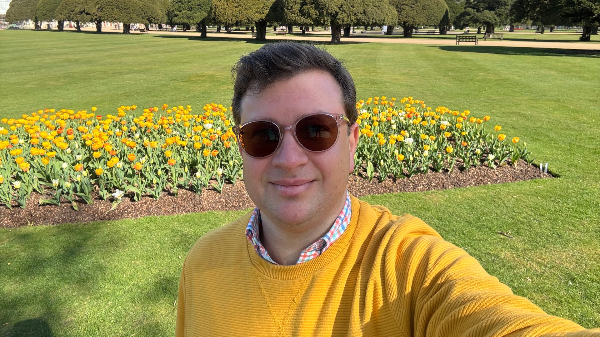 Explore the colourful beds of tulips in the Great Fountain Garden, as recommended by Jonny © visitlondon.com. Image courtesy of Jonny Payne. Our author Jonny Payne, taking a selfie in front of a bed of yellow tulips in the Great Fountain Garden at Hampton Court Palace.