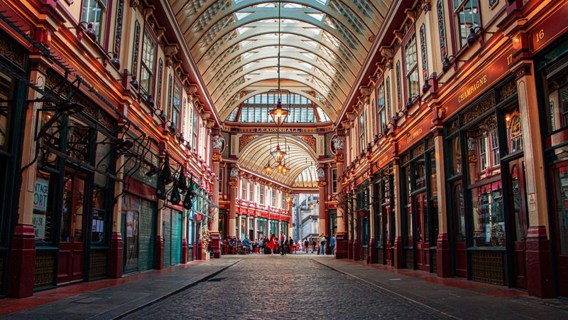 Interior of Leadenhall Market with historic shops lining the pathways.
