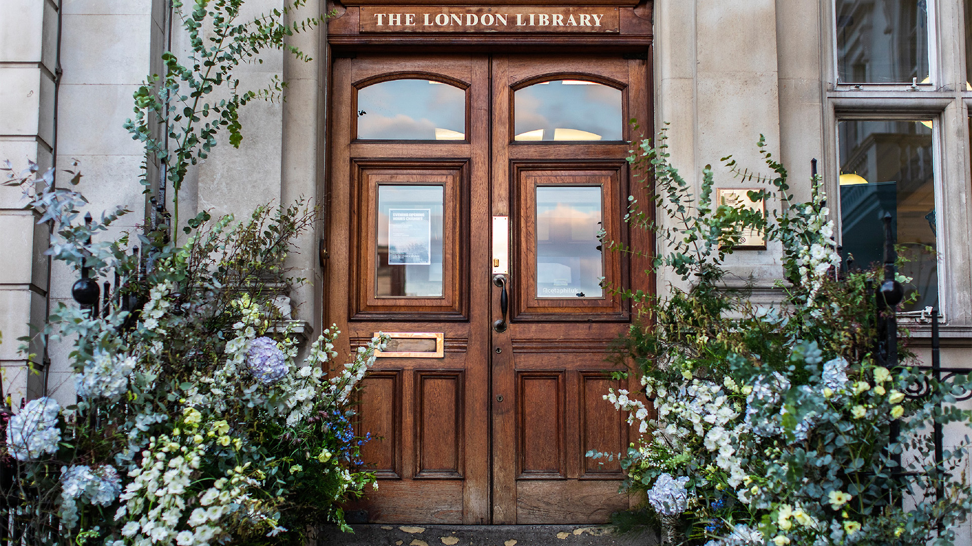 The London Library, St James's Square. Image courtesy of The London Library. Foliage lines the front doors of The London Library