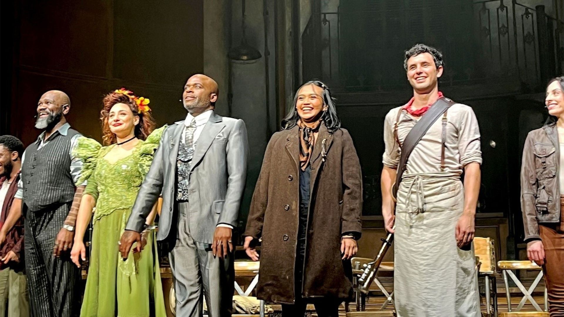 The new cast of Hadestown wows West End audiences with a stunning performance. Photo credit: Carole Rocton The cast of Hadestown stand and salute the Lyric Theatre audience, beaming with joy after their gala performance.