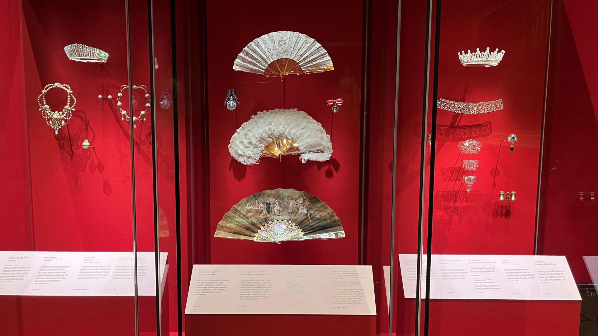 Marvel at the jewels and pearls suitable for any royal event at The King’s Gallery. © Visit London/Charlotte Pritchard. necklaces, crowns and fans exhibited at The King's Gallery.