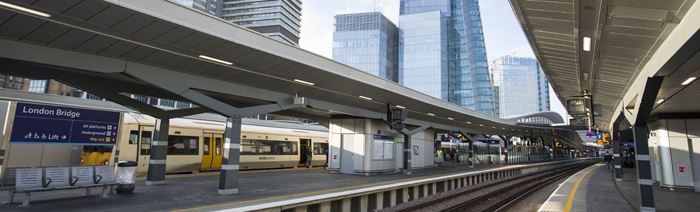 Two empty platforms at London Bridge, busy train station with view on the iconic Shard.