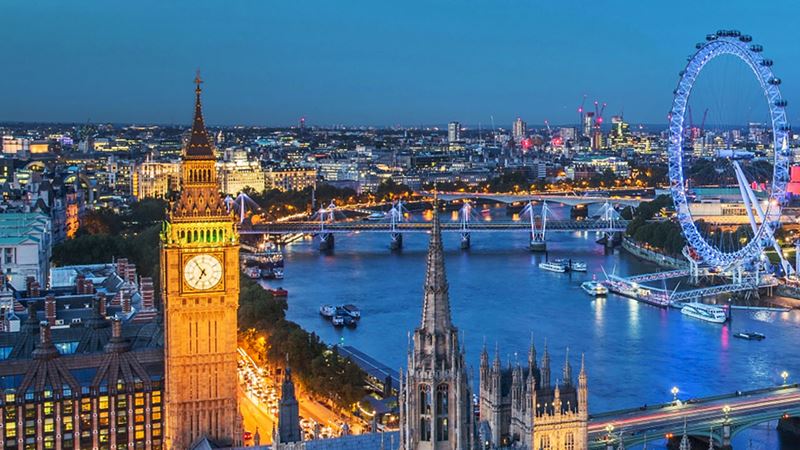 The London skyline at dusk with views of the river Thames, Big Ben and the London Eye
