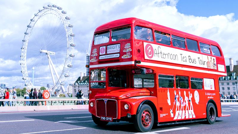 London has so much to offer visitors. Credit: Brigit's Bakery. Image courtesy of Brigit's Bakery Afternoon Tea Bus Tour. Brigit's Afternoon Tea Bus Tour driving along Westminster Bridge, with the London Eye in the background.