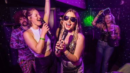 Choose from more than 25,000 songs and sing to your heart's content at Bat and Ball's private karaoke booth. © Golden Tours/John Knight