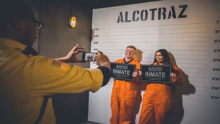 Pose for a mug shot with your fellow inmates at the Alcotraz cocktail experience. Image courtesy of Golden Tours.