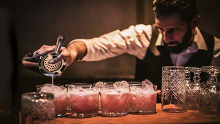 Smuggle in liquor and enjoy bespoke cocktails at the Moonshine Saloon experience London. Image courtesy of Golden Tours.