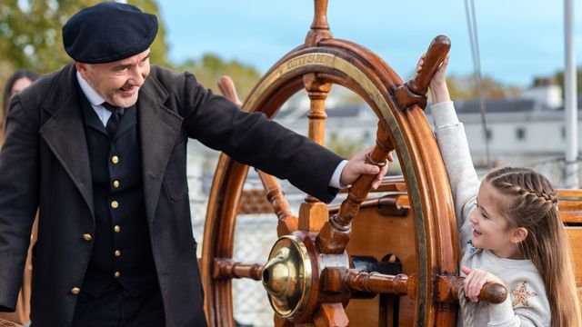 Test your sea legs at Cutty Sark. © Visit Greenwich A young girl steers the wheel of the Cutty Sark ship in Greenwich London.