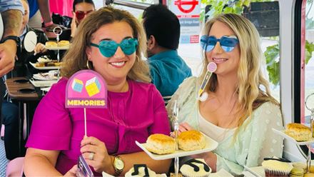 Step aboard the "Here We Go Again" afternoon tea bus tour of London for a unique afternoon tea experience. Image courtesy of Golden Tours.