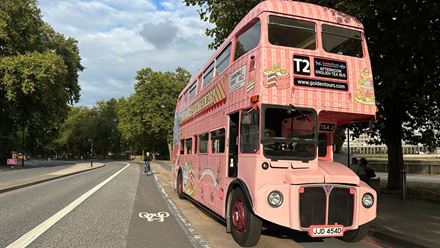 Experience the capital's gorgeous sights while indulging in delicious afternoon tea treats on board London's iconic afternoon tea bus. Image courtesy of Golden Tours.