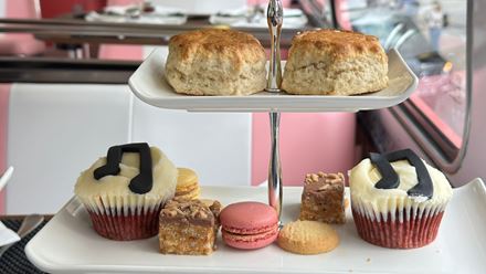 Savour a delicious afternoon tea and complimentary glass of prosecco on the unique "Here We Go Again" afternoon tea bus tour. Image courtesy of Golden Tours.