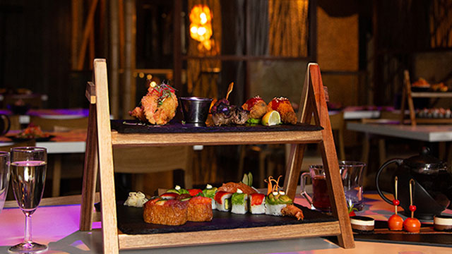 Inamo's pan-Asian afternoon tea, featuring an array of maki and sushi, fried chicken, meatballs and champagne.