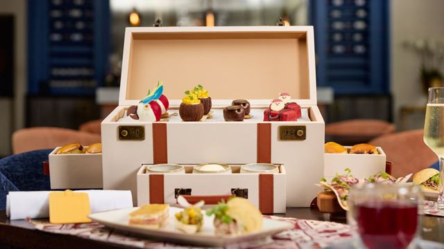 festive afternoon tea treats displayed in a briefcase style box