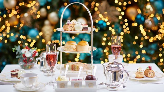 festive decorations around a table of Christmas themed afternoon tea