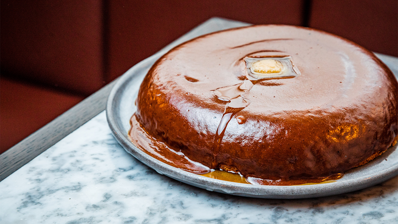 Delight in Sunday in Brooklyn's iconic hazelnut maple praline and brown butter pancakes. Credit: Lucas Smith. Image courtesy of Sunday in Brooklyn. A hazelnut maple praline and brown butter american-style pancake
