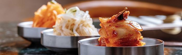 Close-up on an assortment of Kimchi and pickled vegetables.