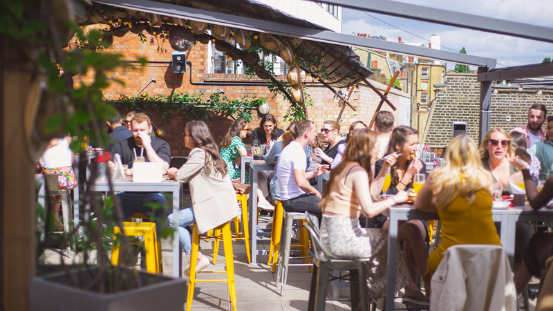 Big Chill King's Cross roof terrace. Credit: Big Chill King's Cross. Image courtesy of Big Chill King's Cross. Tables of guests on the roof terrace of Big Chill King's Cross