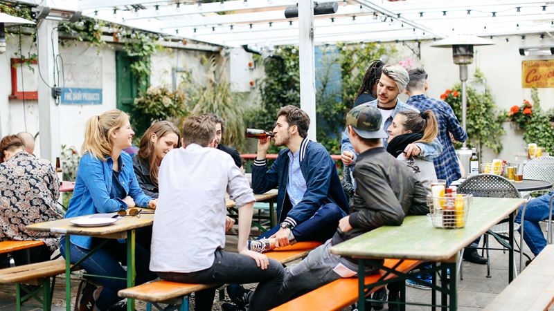 A group of customers enjoy a chat in the Crown & Shuttle's beer garden. Image courtesy of Crown & Shuttle.