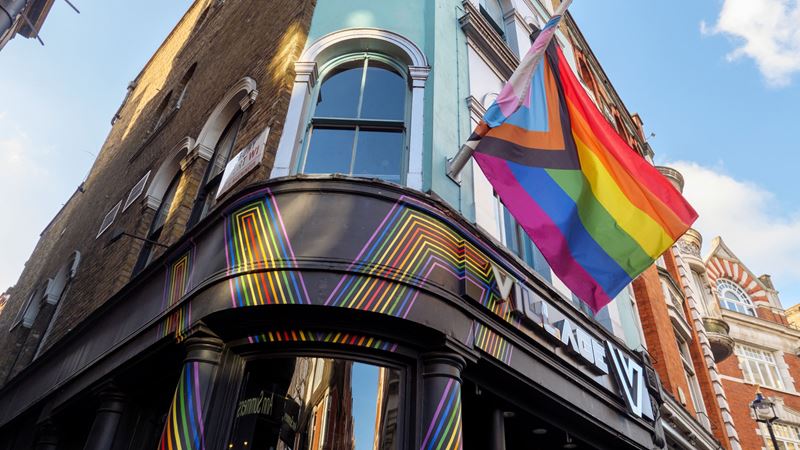 Grab mates and head to one of the iconic events at Village Soho. Credit: Shutterstock. Image courtesy of Shutterstock. A photo of the exterior of Village Soho with LGBTQ+ flags hanging from above