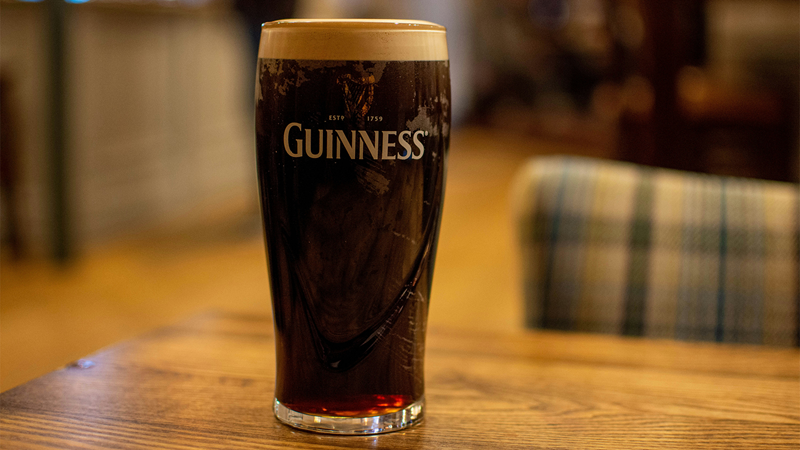 Taste some of the best Guinness outside of Ireland at the many Irish pubs in London. Credit: Richard Bell. Image courtesy of Unsplash. A glass of Guinness sitting on a wooden table