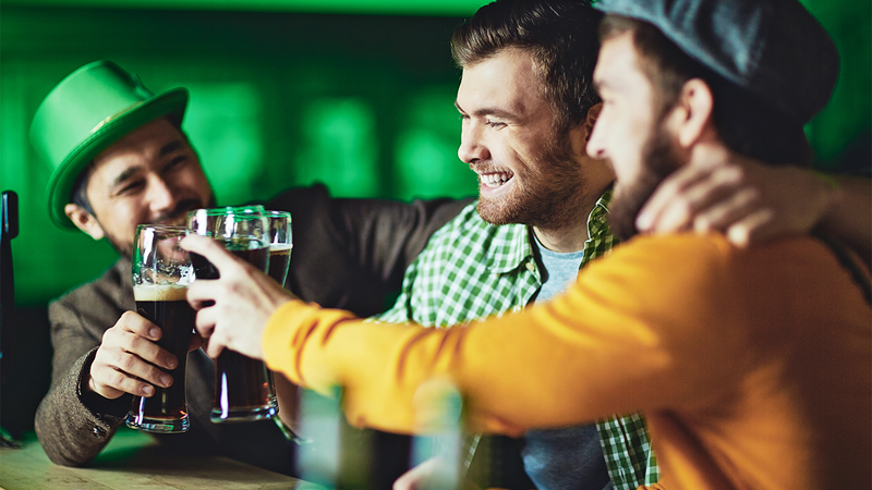 A group of friends cheers to St Patrick's Day