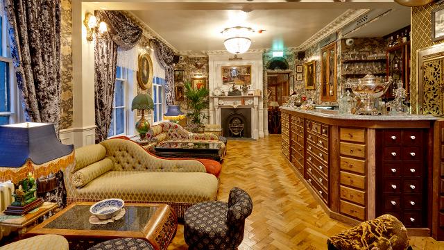 Mr Fogg's Gin Parlour in Covent Garden. Image courtesy of Mt Fogg's Gin Parlour. A london gin parlour with sofas and tables.