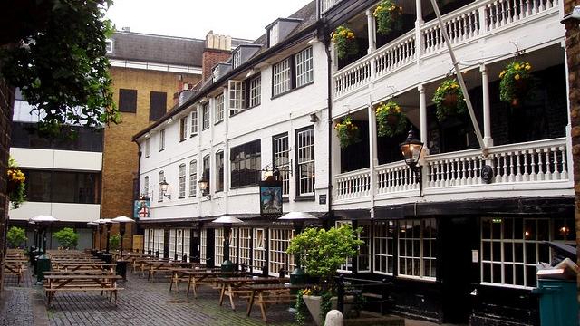 The George Inn. Photo: Ewan Munro. Image courtesy of The National Trust. The exterior of The George Inn, with its white galleries and picnic tables in the courtyard.