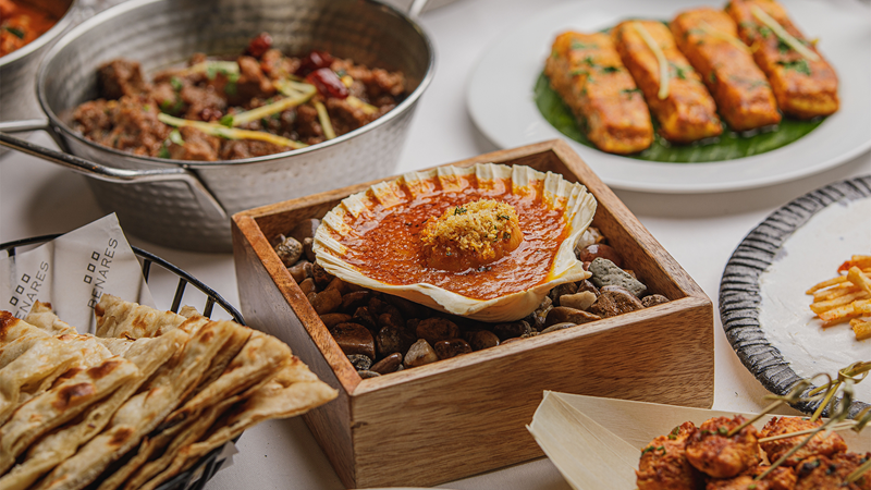 Savour a flavourful Indian Christmas tasting menu at Benares. Credit: Nandit Desai. Image courtesy of Benares Restaurant. A selection of Indian small plates including the baked Malabar Scottish scallop