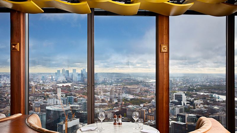 Tuck into a delicious meal with a view. Credit: Steven Joyce. Image courtesy of Duck & Waffle. Views over the City of London from Duck & Waffle.