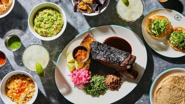 A selection of dishes spread across a grey table.