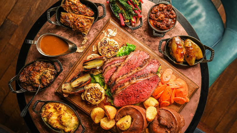 Share a delicious Hawksmoor Sunday roast with all the trimmings. Credit: Hawksmoor. Image courtesy of Hawksmoor. A sharing dish of Hawksmoor's Sunday roast with beef, vegetables and gravy