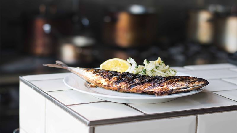 A chargrilled fish on a plate at Hereford Road.