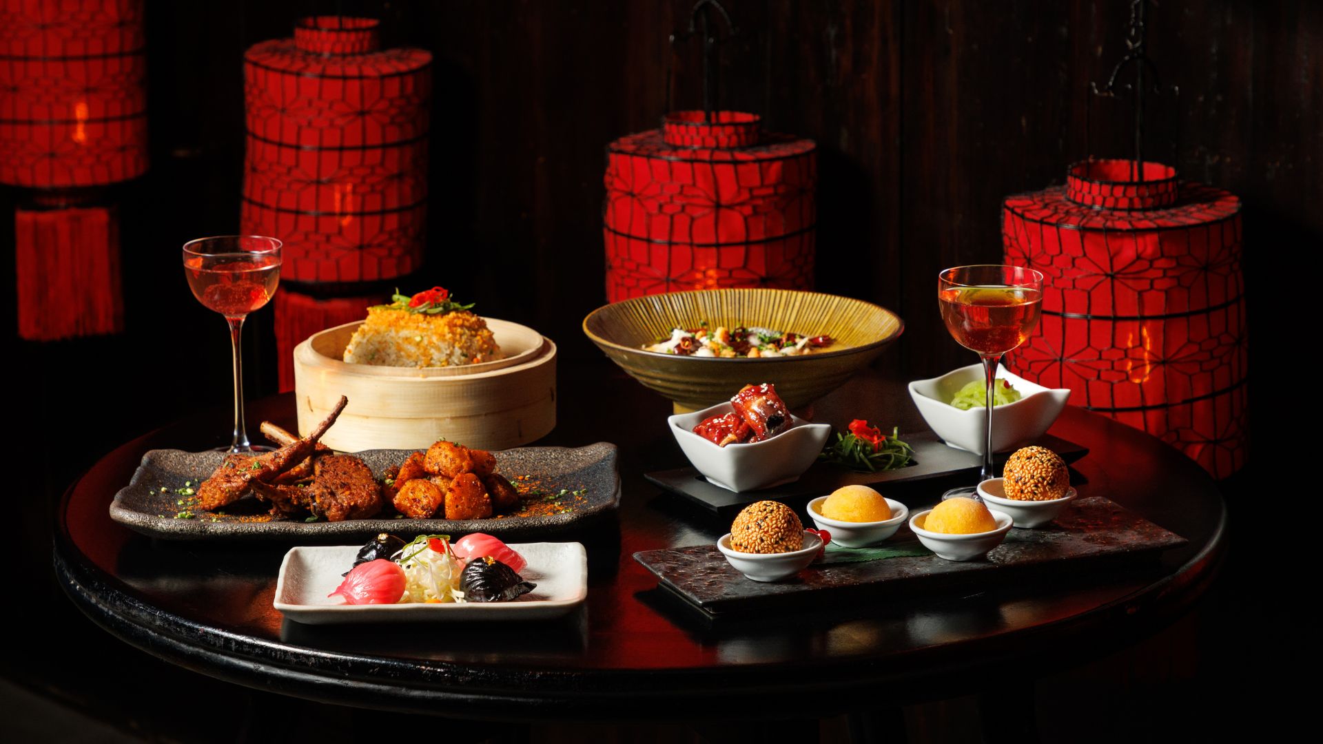 Celebrate Valentine's Day with a unique meal in one of London's most romantic settings at Hutong at The Shard. Image courtesy of Circle PR. A table covered in chinese dishes on plates and dumpling bowls.