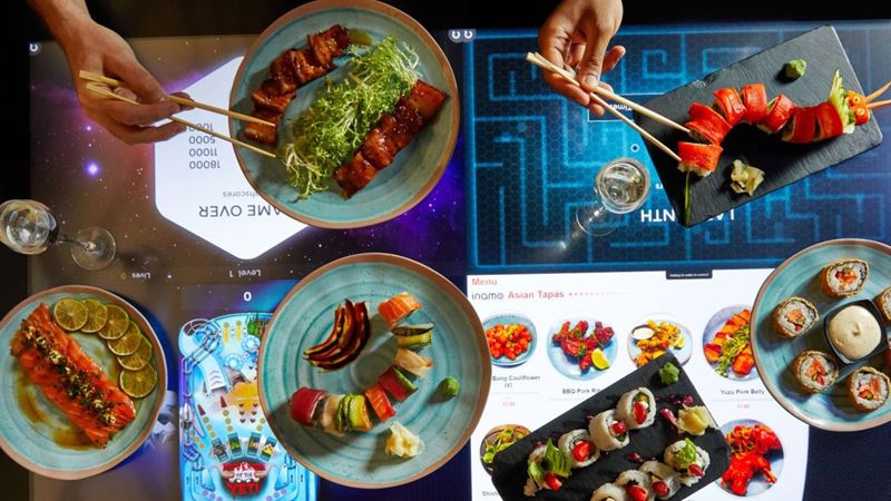 Keep the children entertained before tucking into tasty dishes at inamo. Credit: Golden Tours. Image courtesy of Golden Tours. An interactive table with sushi at inamo london.