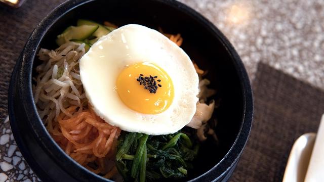 Bibimbap at Olle. Image courtesy of Street & Co. A fried egg tops Korean food at Olle
