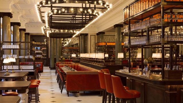 Holborn Dining Room. Image courtesy of Holborn Dining Room. A luxury restaurant with brown leather seats and bright lights.