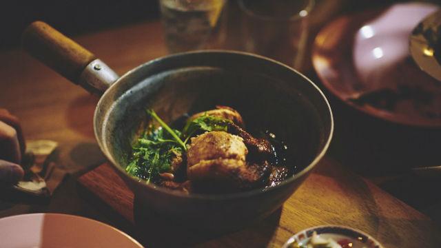 A skillet of braised chicken at shoreditch restaurant smoking goat in london.