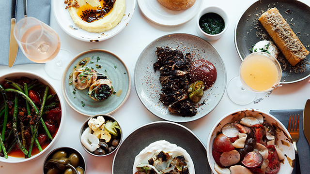 Selection of dishes served at The Omni COllective, a plant-based restaurant with a seasonal menu.