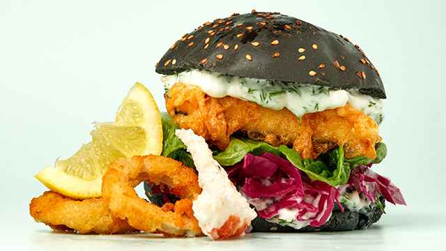 The Tofish burger, the famous plant based battered fish burger with its tartare sauce served in a charcoal bun.