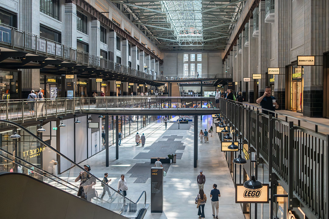 Inside Battersea Power Station. Image credit: Visit London/Michael Barrow. The inside of the shopping area within Battersea Power Station