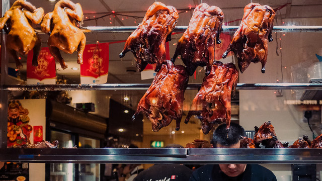 Peking duck in London Chinatown restaurant window display.