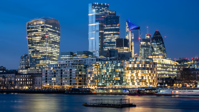 Lights glowing in the evening sky from high rises buildings in City of London
