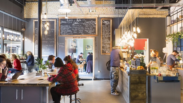 Tuck in to tasty food and exceptional coffee at Byte Cafe. Credit: Croydon Council. Image courtesy of Croydon Council. Customers sat inside and being served at Byte Café in Croydon.