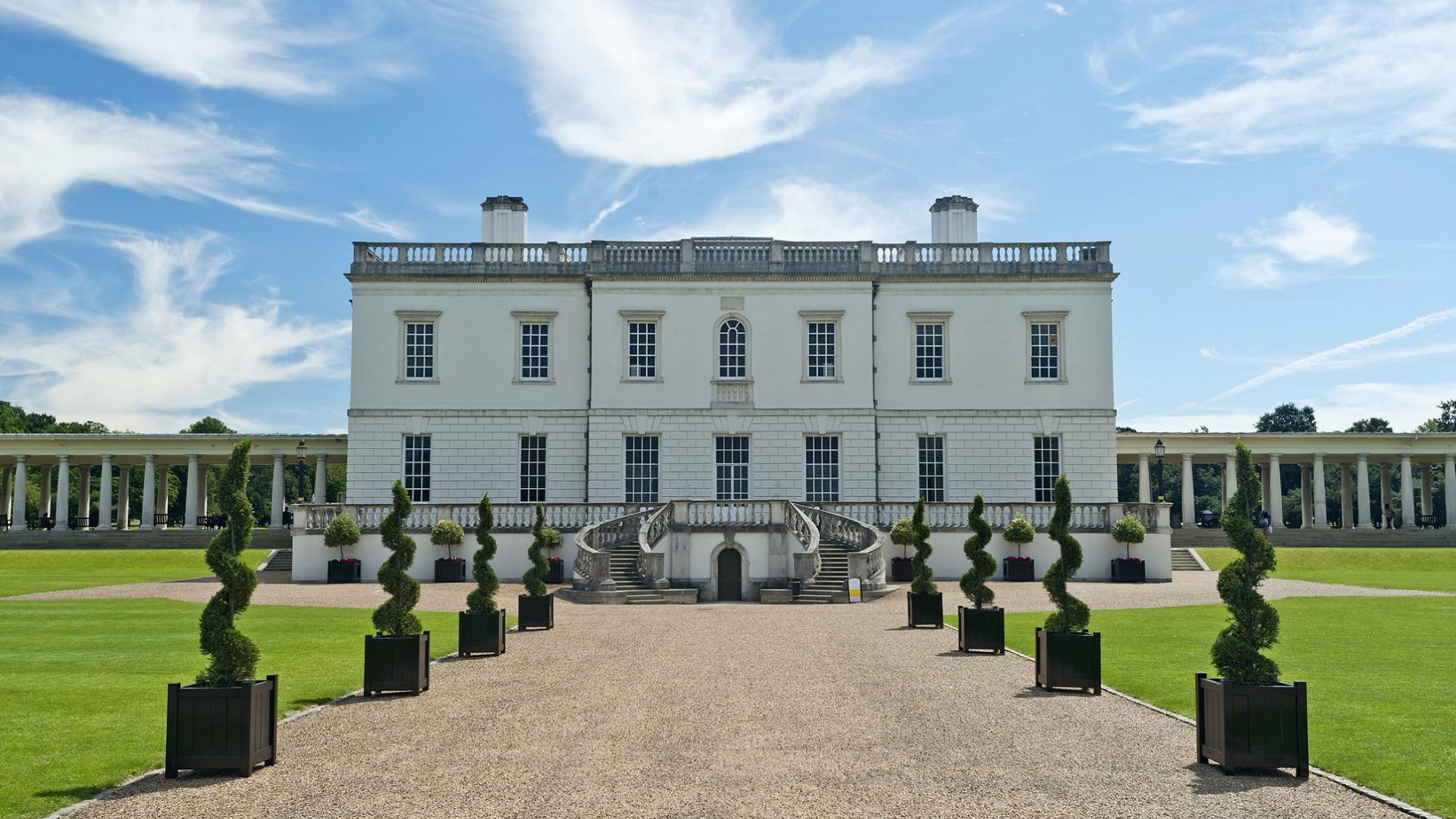 Admire the Queen's House, a royal villa in Greenwich. Image courtesy of Visit Greenwich. Topiary lines a gravel path to the Queen's House, a royal villa in Greenwich.