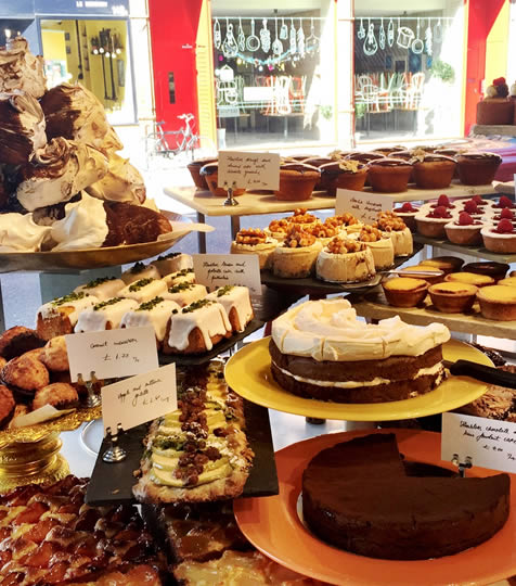 Window display of cakes and pastries at Ottolenghi in  Islington