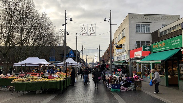 traders and fruit and veg stalls line the street at Walthamstow Market
